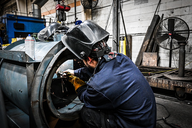 expert-repairing-industrial-fan