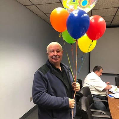 team-member-celebration-with-balloons